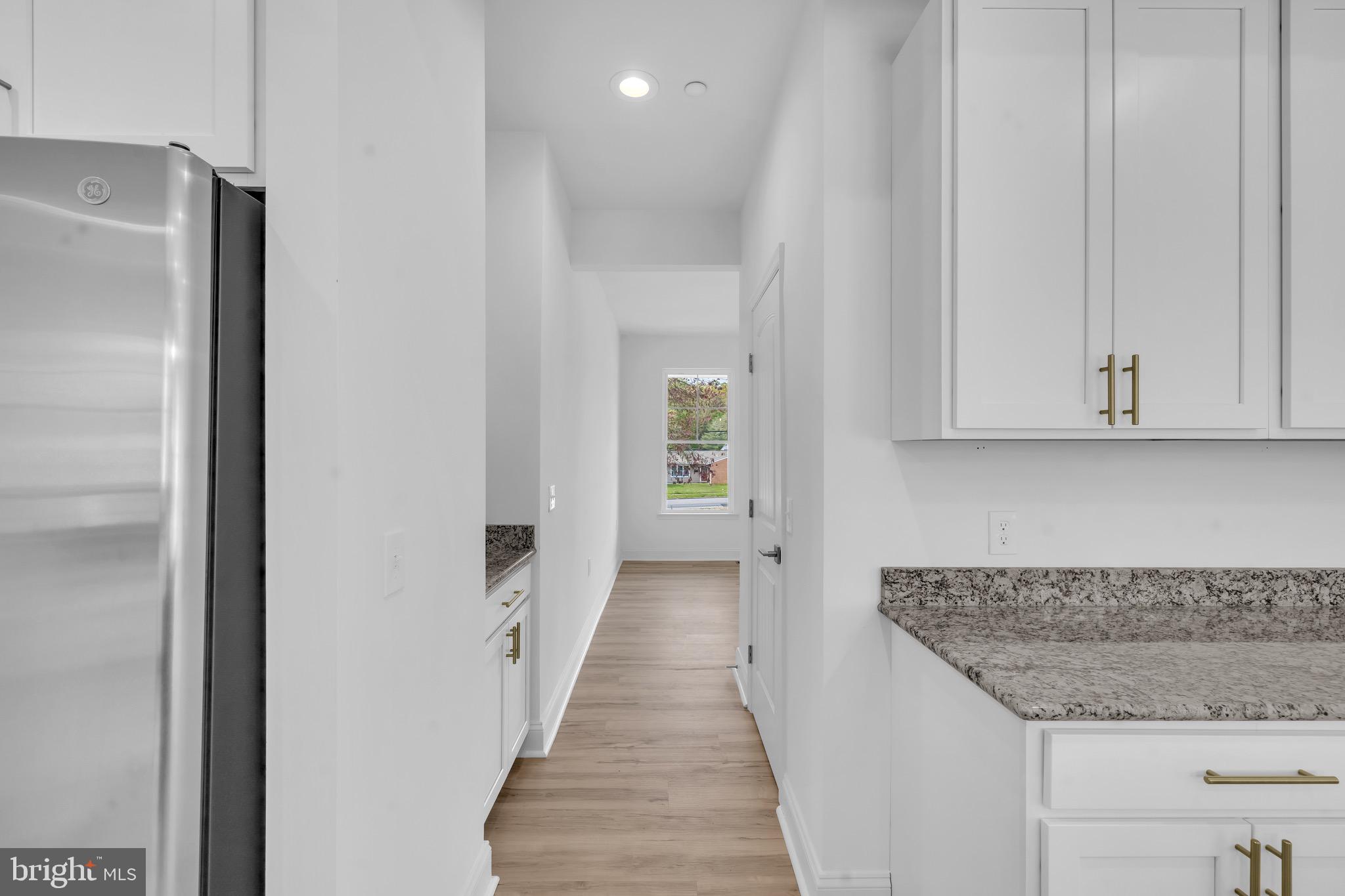 415 Trimble Road Joppa, MD 21085 - Photo 10 of 14 a kitchen with white cabinets