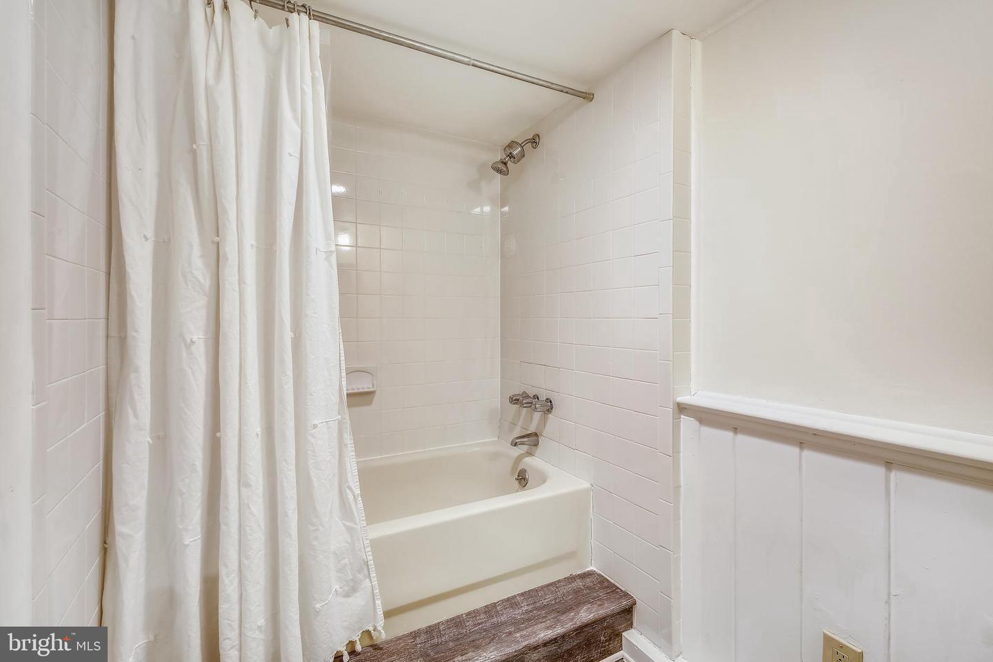 10310 Brunswick Avenue Silver Spring, MD 20902 - Photo 3 of 4 a bathroom with a bathtub and shower