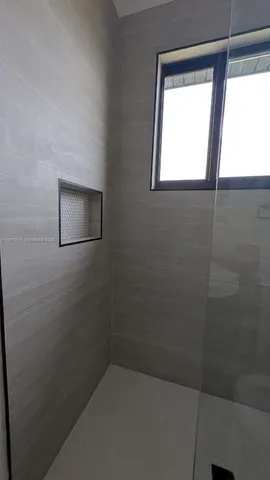 a bathroom that has a window