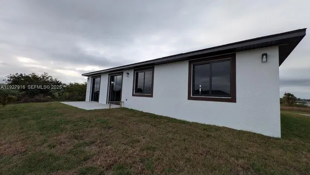 a house with yard in front of it