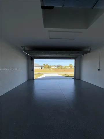 a view of an empty room and a window