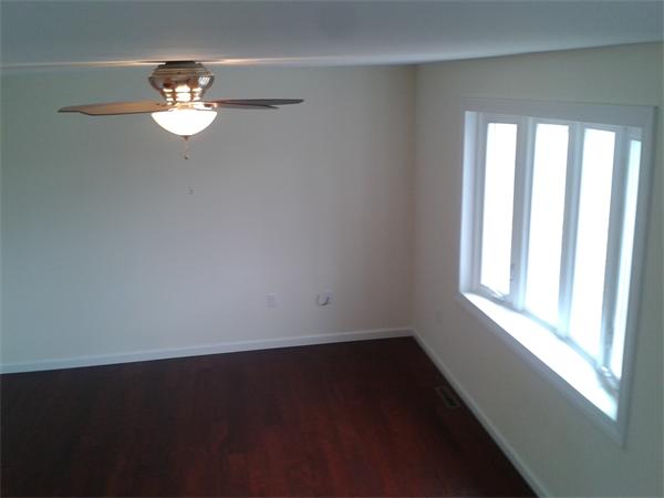 365 Abbott Street Springfield, MA 01118 - Photo 11 of 27 wooden floor in an empty room with a window
