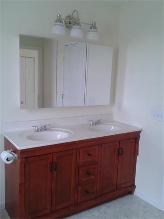 365 Abbott Street Springfield, MA 01118 - Photo 17 of 27 a bathroom with a sink and a mirror