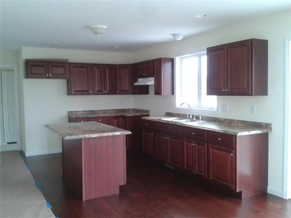 365 Abbott Street Springfield, MA 01118 - Photo 7 of 27 a kitchen with a stove a sink and a microwave