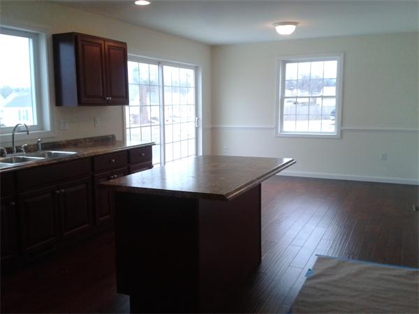 365 Abbott Street Springfield, MA 01118 - Photo 9 of 27 a kitchen with sink cabinets and wooden floor