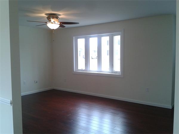 365 Abbott Street Springfield, MA 01118 - Photo 10 of 27 a view of empty room with wooden floor and fan