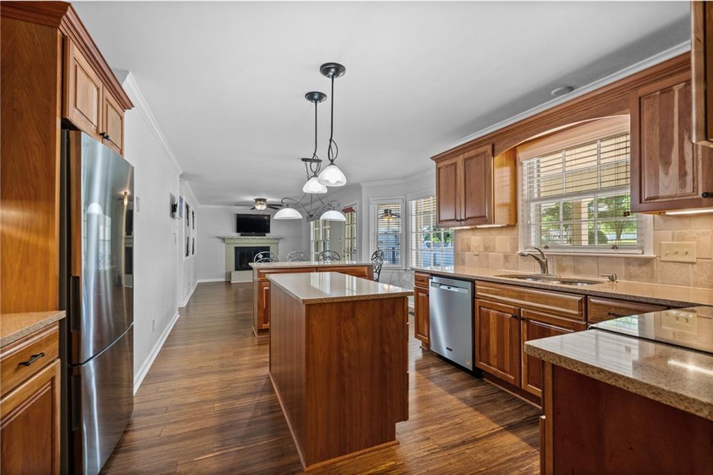 240 Deerfield Road Bogart, GA 30622 - Photo 12 of 80 a kitchen with stainless steel appliances granite countertop a sink a stove and refrigerator