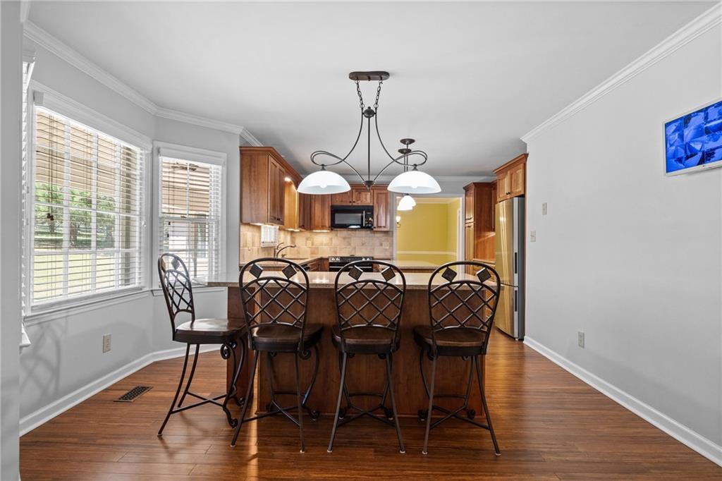 240 Deerfield Road Bogart, GA 30622 - Photo 16 of 80 a view of a dining room with furniture window and wooden floor