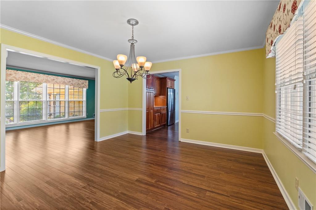 240 Deerfield Road Bogart, GA 30622 - Photo 20 of 80 a view of a room with wooden floor chandelier and windows
