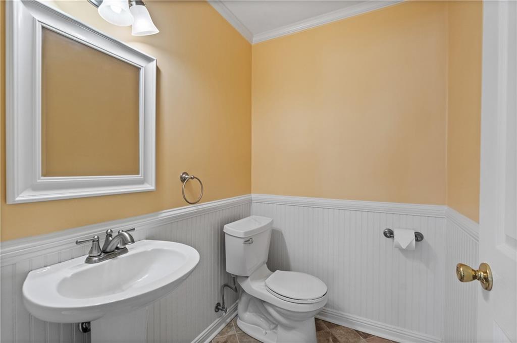 240 Deerfield Road Bogart, GA 30622 - Photo 24 of 80 a bathroom with a sink mirror and toilet