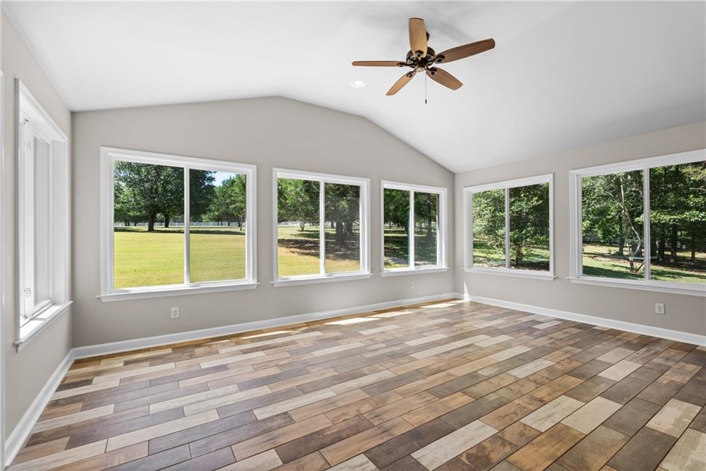 240 Deerfield Road Bogart, GA 30622 - Photo 25 of 80 a view of an empty room with a window and wooden floor