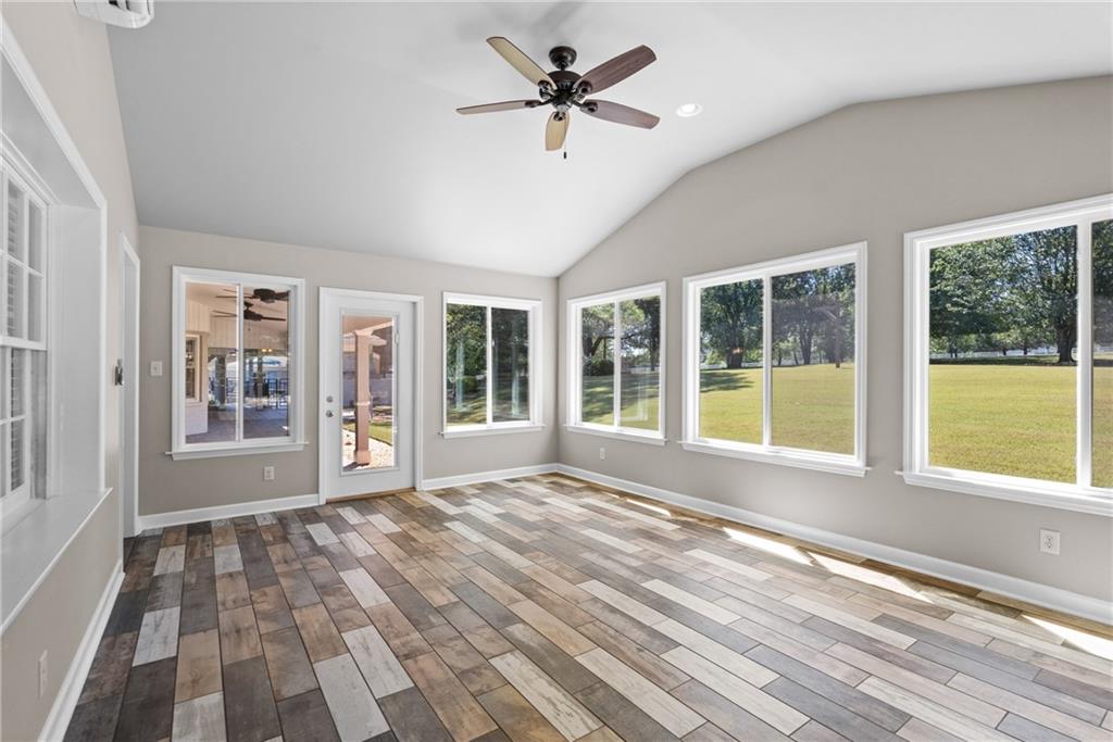 240 Deerfield Road Bogart, GA 30622 - Photo 26 of 80 a view of an empty room with a window and wooden floor