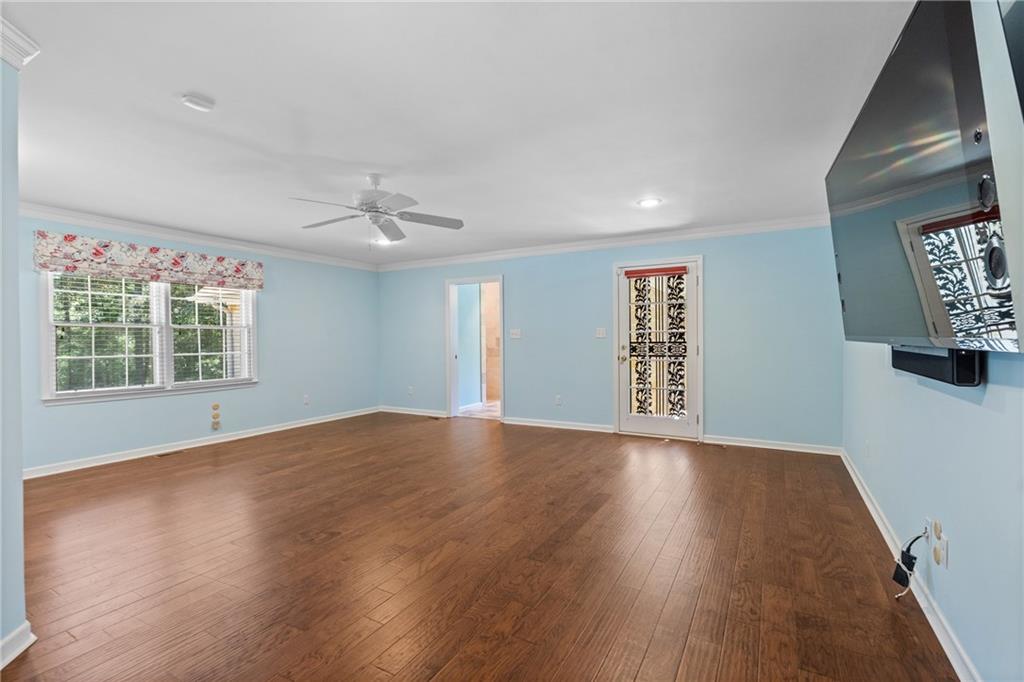 240 Deerfield Road Bogart, GA 30622 - Photo 29 of 80 a view of an empty room with a window and wooden floor