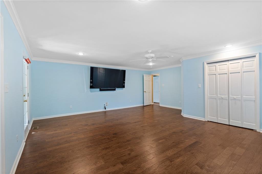 240 Deerfield Road Bogart, GA 30622 - Photo 30 of 80 a view of an empty room with wooden floor and windows