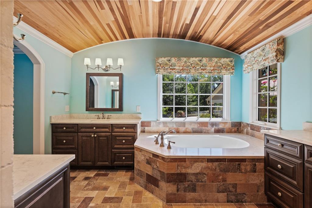 240 Deerfield Road Bogart, GA 30622 - Photo 32 of 80 a spacious bathroom with a tub sink and mirror