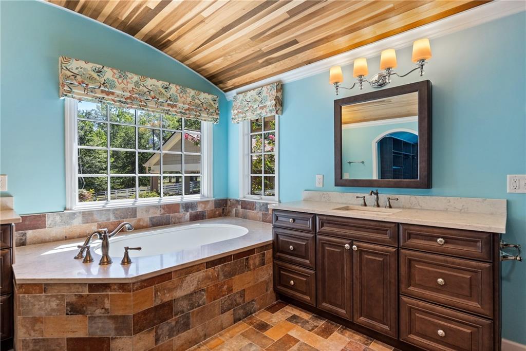 240 Deerfield Road Bogart, GA 30622 - Photo 33 of 80 a bath room with a sink and a large window