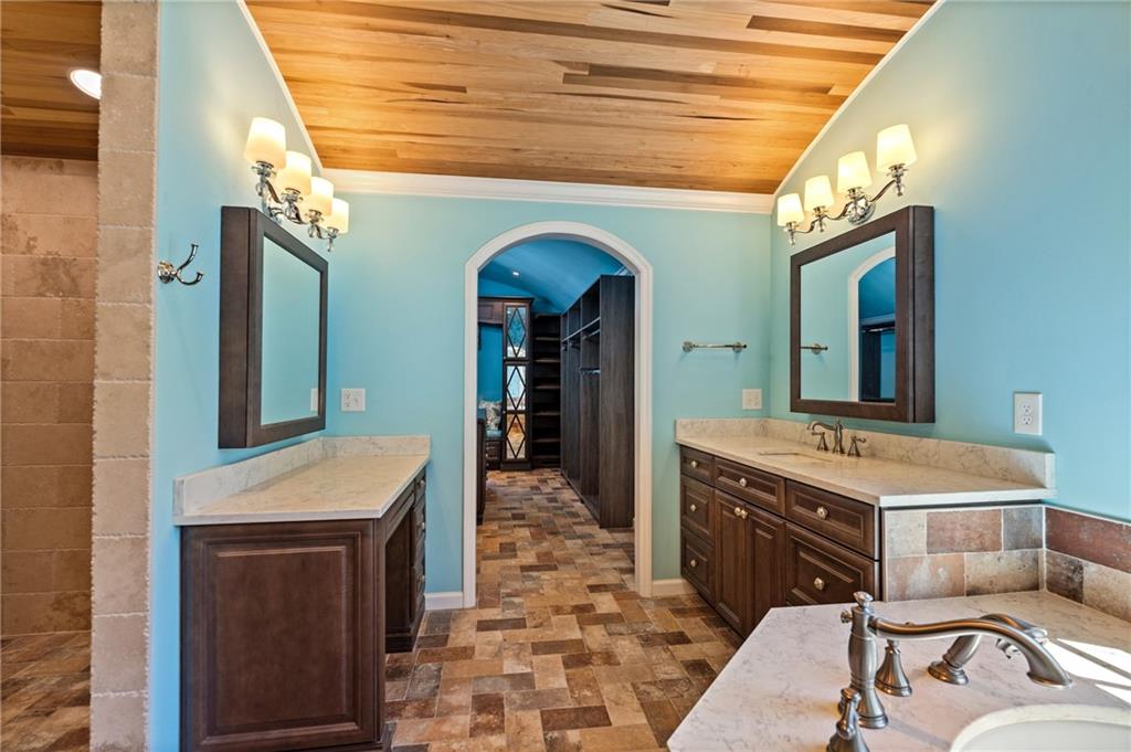 240 Deerfield Road Bogart, GA 30622 - Photo 38 of 80 a bathroom with a sink a vanity and a mirror
