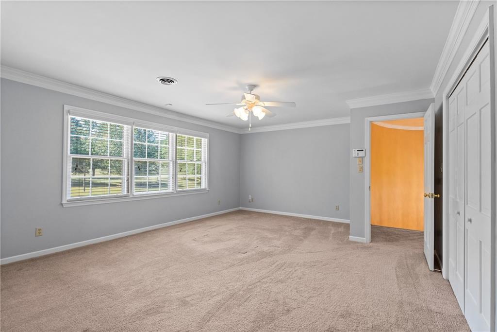 240 Deerfield Road Bogart, GA 30622 - Photo 42 of 80 an empty room with a window and a kitchen