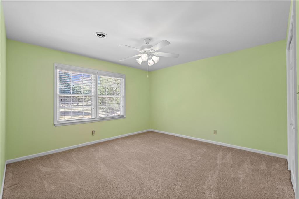 240 Deerfield Road Bogart, GA 30622 - Photo 48 of 80 an empty room with a window and a fan