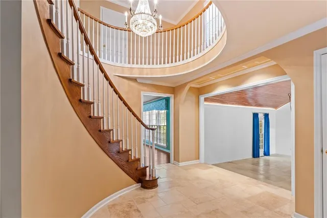 a kitchen with stainless steel appliances granite countertop a sink a stove and refrigerator