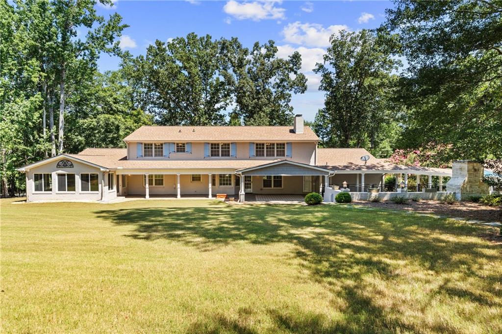 240 Deerfield Road Bogart, GA 30622 - Photo 75 of 80 a front view of a house with a garden