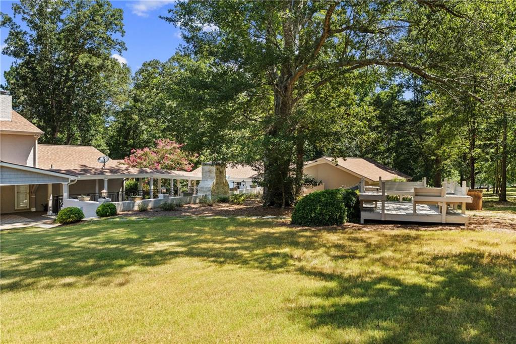240 Deerfield Road Bogart, GA 30622 - Photo 76 of 80 a view of a house with a big yard and large trees