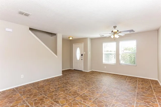 a view of an empty room with a window
