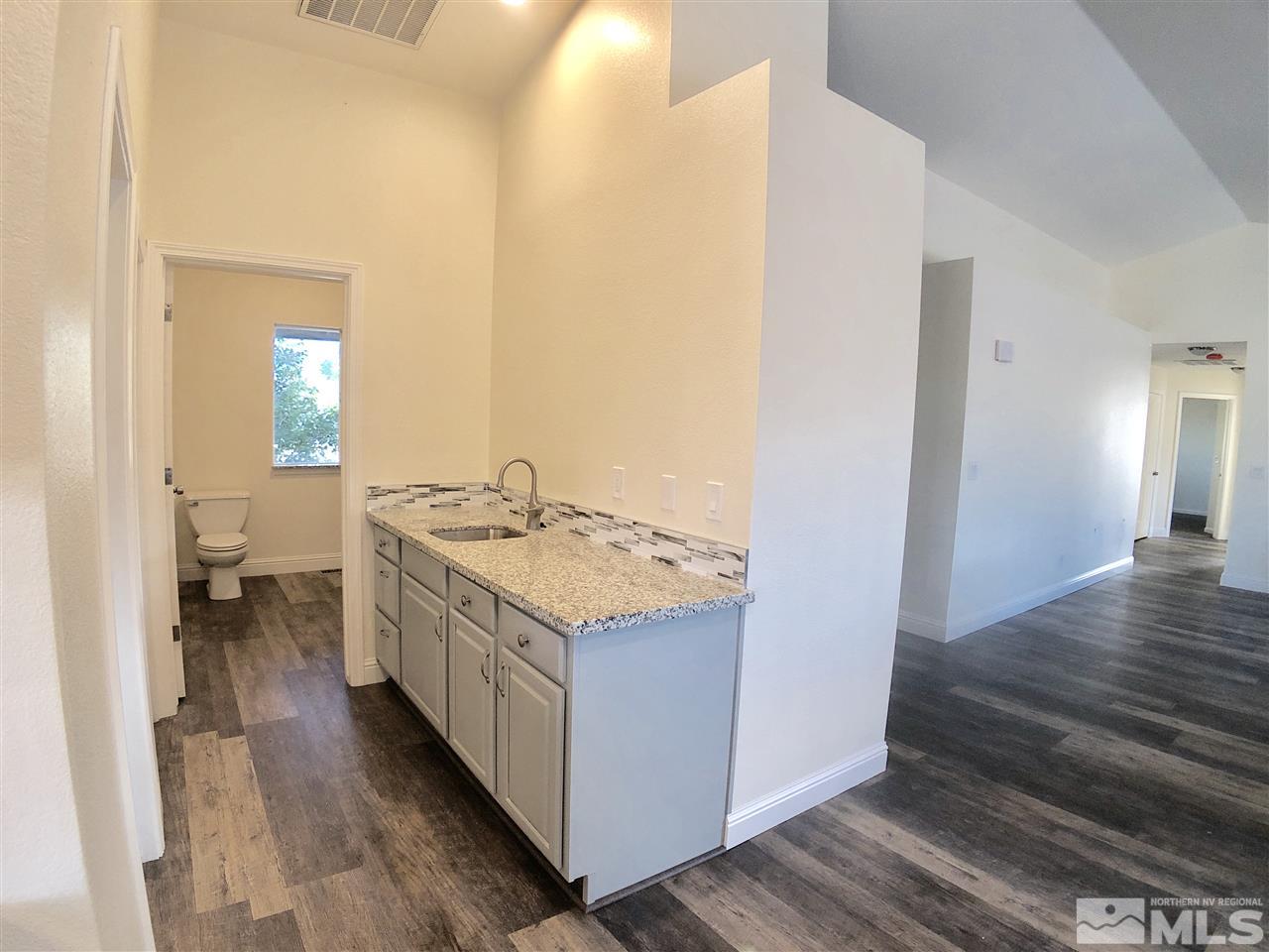 10205 Placerville Road Reno, NV 89508 - Photo 15 of 40 a bathroom with a granite countertop sink and a mirror