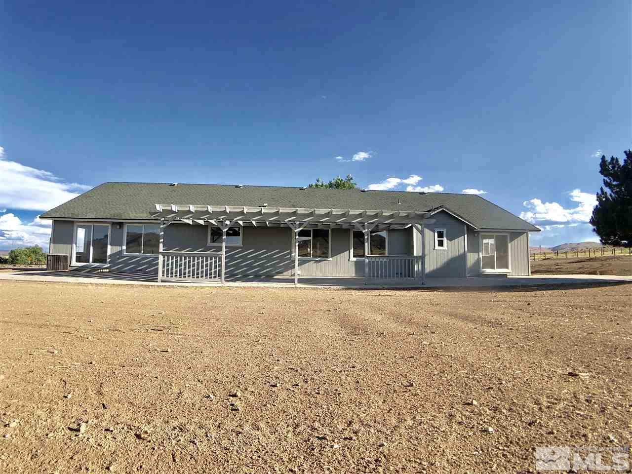 10205 Placerville Road Reno, NV 89508 - Photo 34 of 40 a front view of a house with a yard