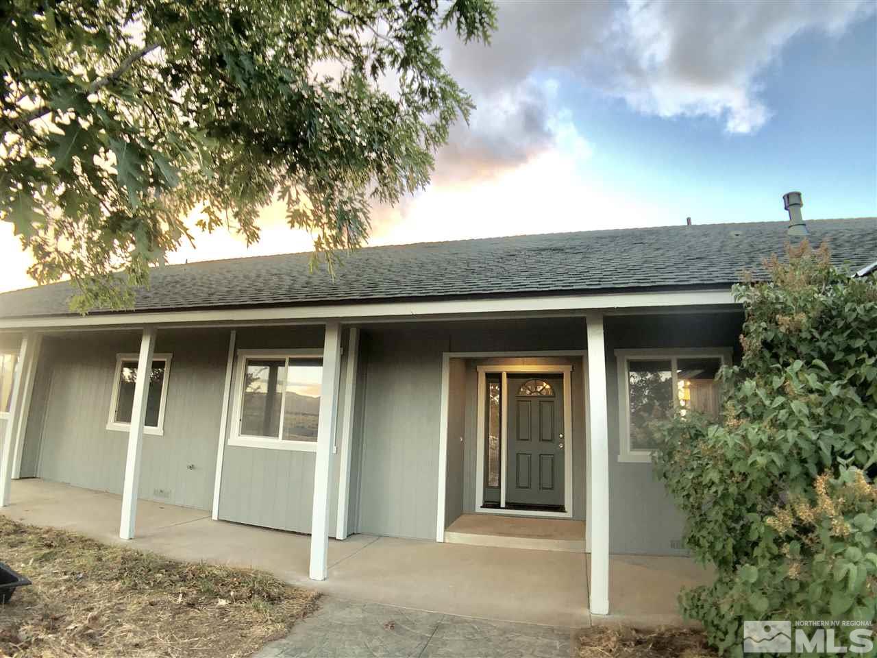 10205 Placerville Road Reno, NV 89508 - Photo 5 of 40 a front view of a house with a tree