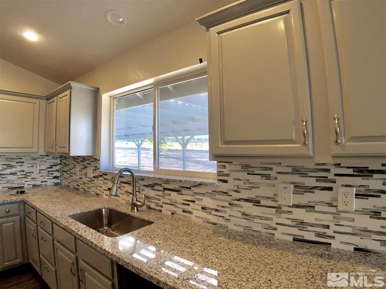 10205 Placerville Road Reno, NV 89508 - Photo 9 of 40 a view of a sink and dishwasher with a sink