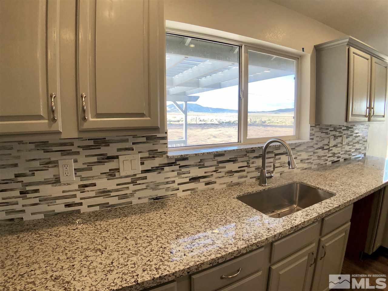 10205 Placerville Road Reno, NV 89508 - Photo 10 of 40 a kitchen with a sink and large window