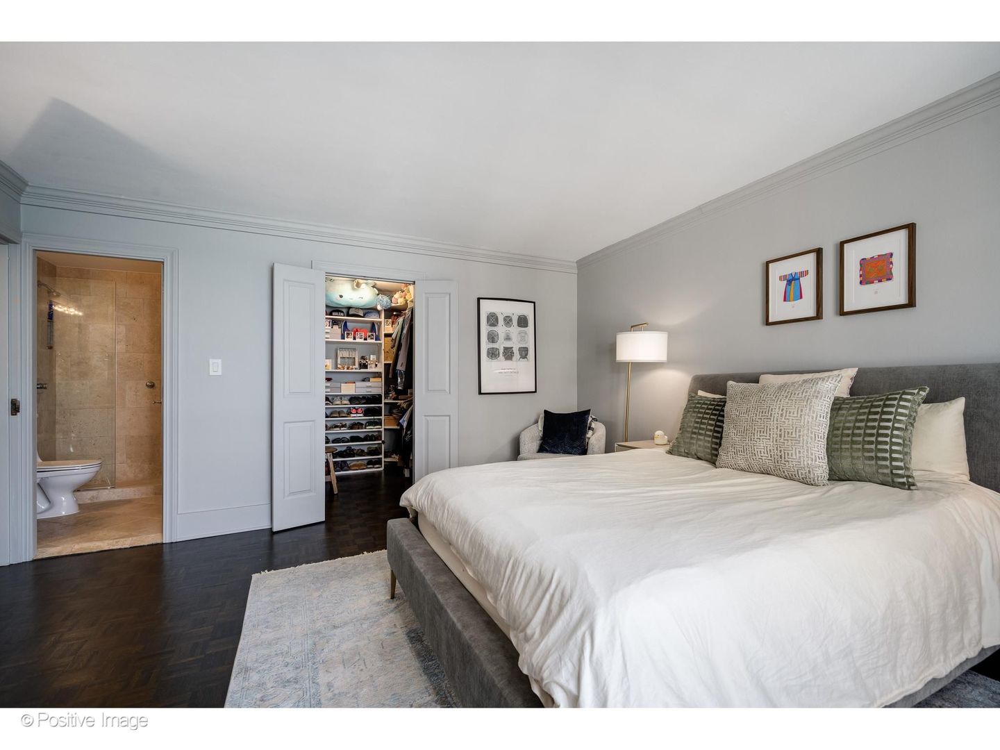 1310 North Ritchie Court, Unit 26C Chicago, IL 60610 - Photo 18 of 34 a bedroom with a large bed and a view of kitchen