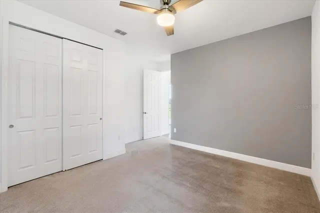 a view of an empty room and a window
