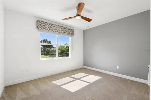 an aerial view of a house with garden space and street view
