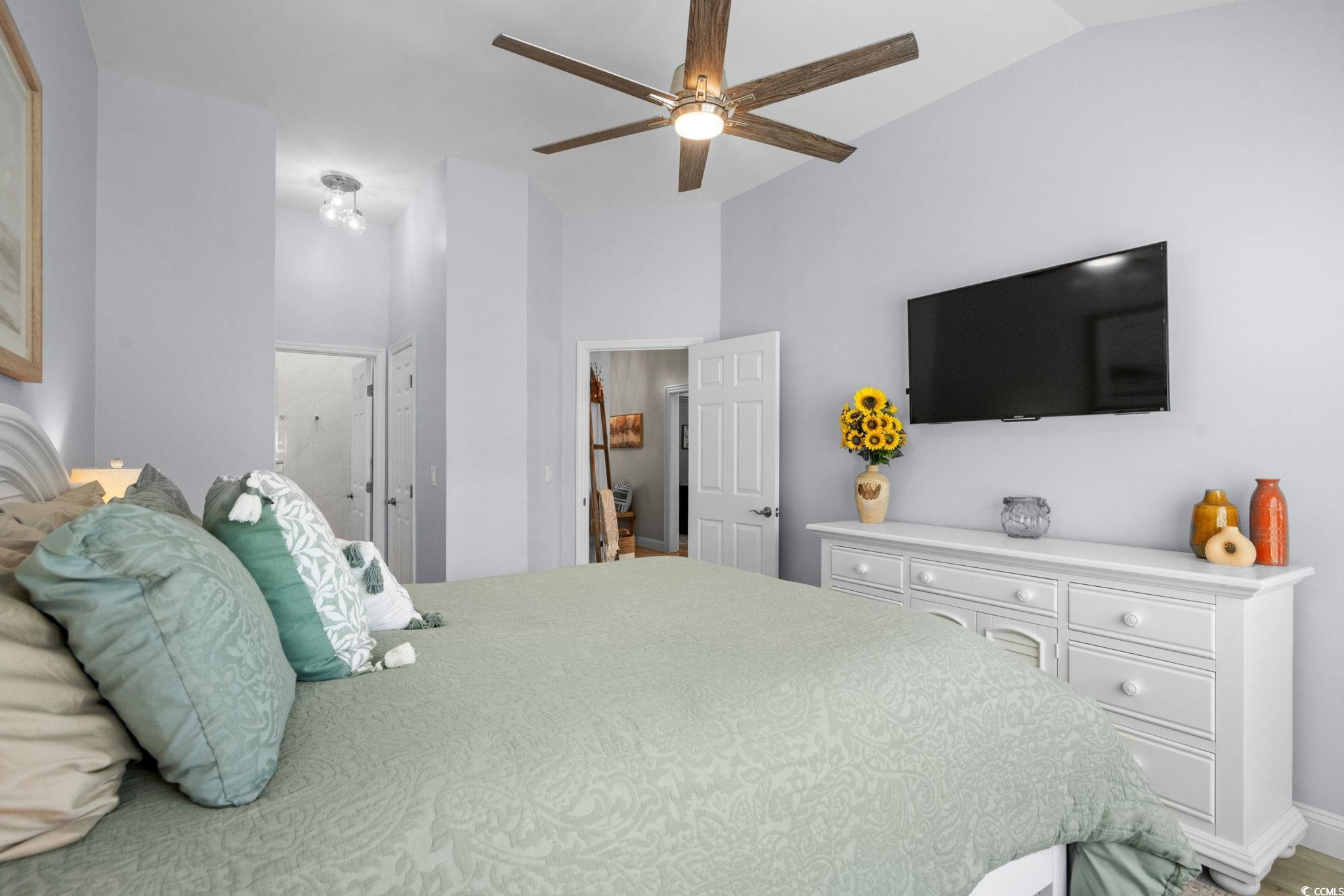 408 Highland Ridge Drive Myrtle Beach, SC 29588 - Photo 20 of 39 Bedroom featuring vaulted ceiling, a ceiling fan, and ensuite bathroom