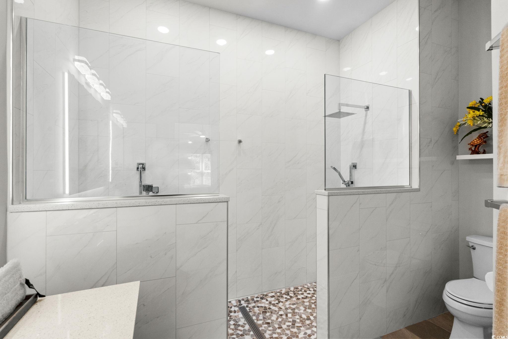 408 Highland Ridge Drive Myrtle Beach, SC 29588 - Photo 23 of 39 Full bathroom with a walk in shower, tile walls, and recessed lighting