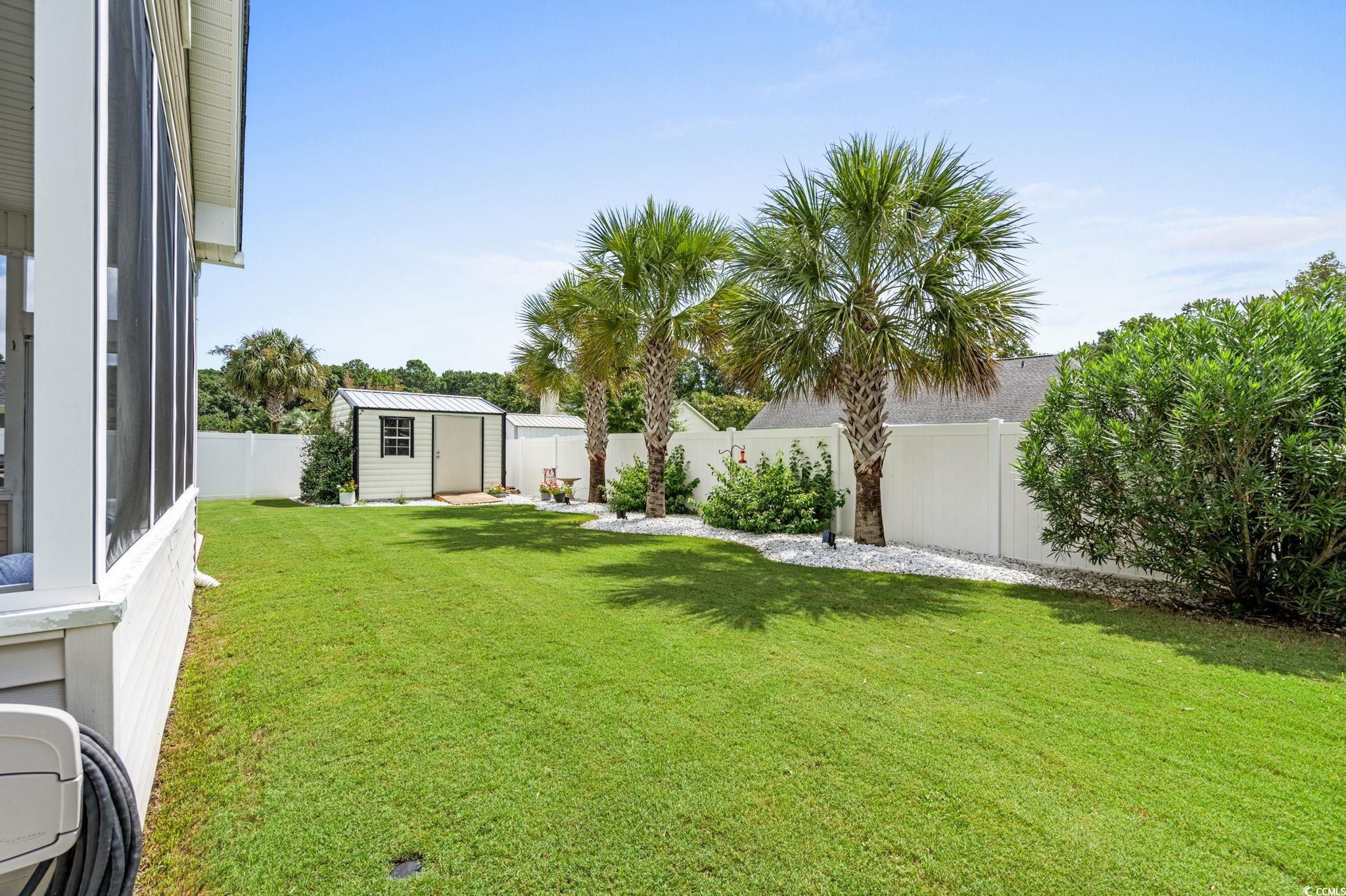 408 Highland Ridge Drive Myrtle Beach, SC 29588 - Photo 33 of 39 Fenced backyard with a storage unit