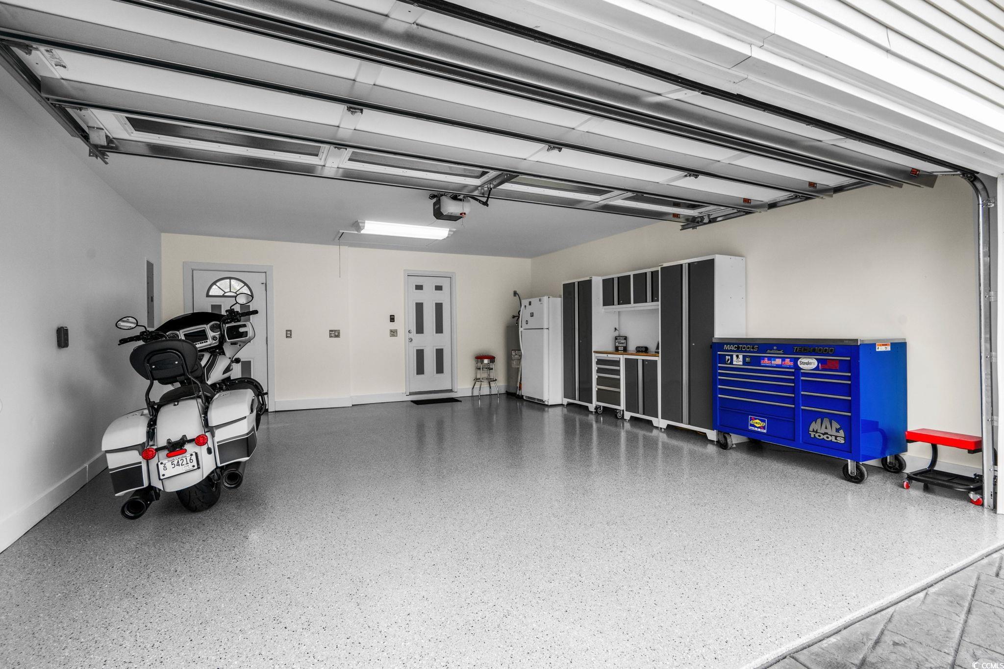 408 Highland Ridge Drive Myrtle Beach, SC 29588 - Photo 36 of 39 Garage with freestanding refrigerator and baseboards