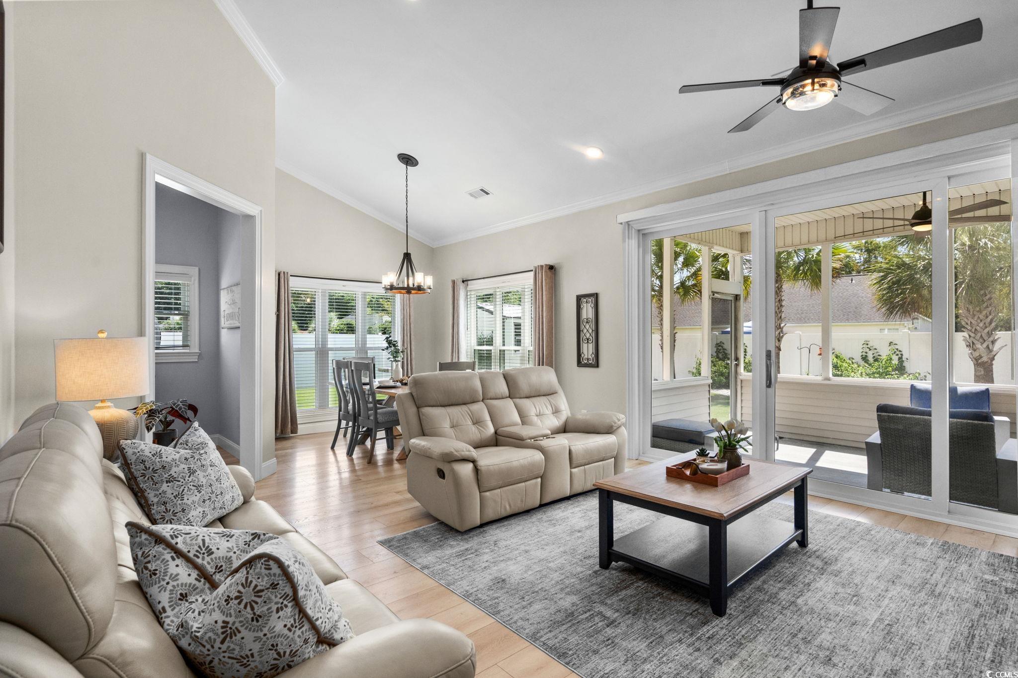 408 Highland Ridge Drive Myrtle Beach, SC 29588 - Photo 4 of 39 Living room with crown molding, a chandelier, light wood-style flooring, recessed lighting, and a ceiling fan