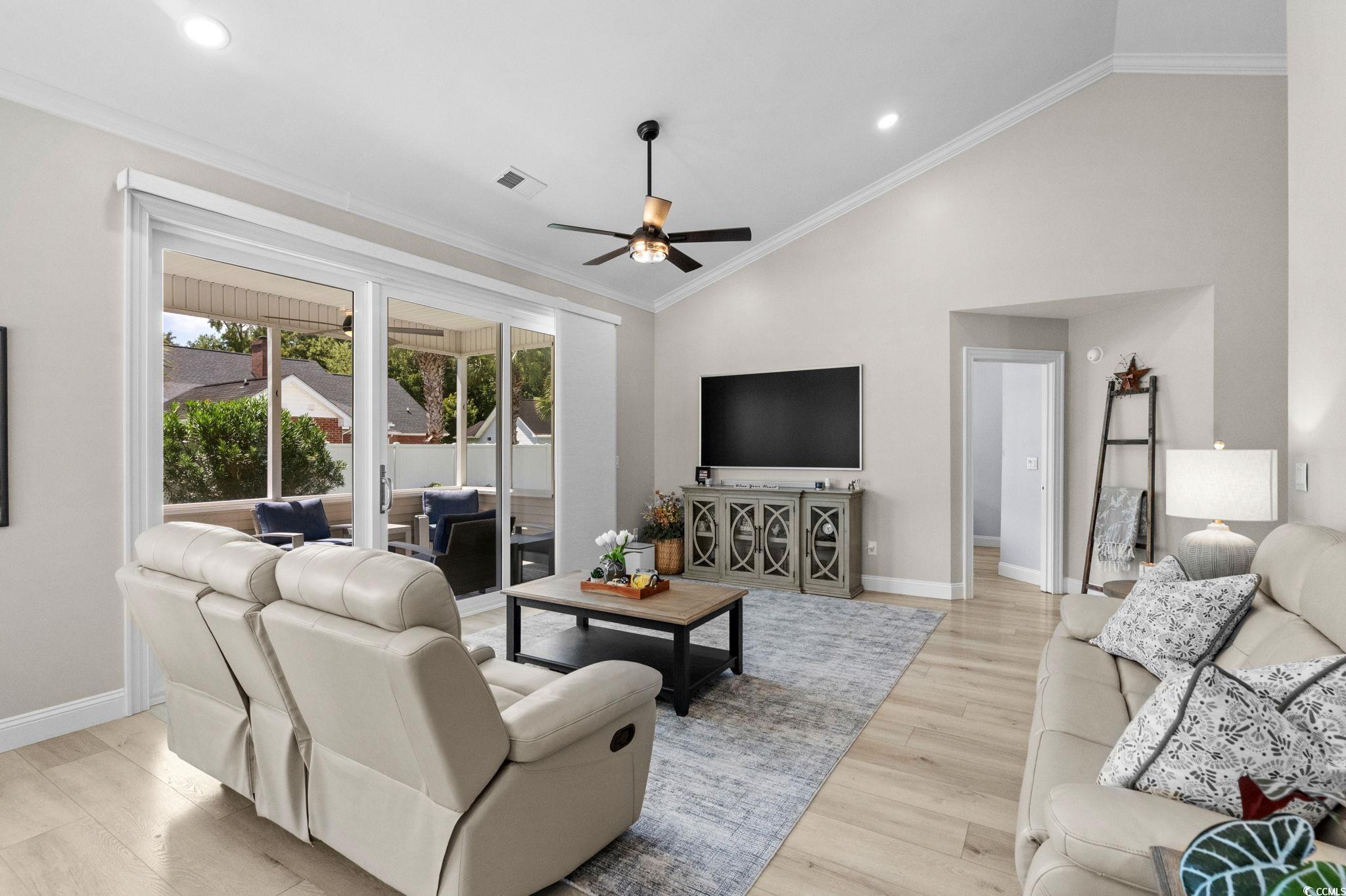 408 Highland Ridge Drive Myrtle Beach, SC 29588 - Photo 6 of 39 Living room with ornamental molding, light wood finished floors, recessed lighting, a ceiling fan, and high vaulted ceiling