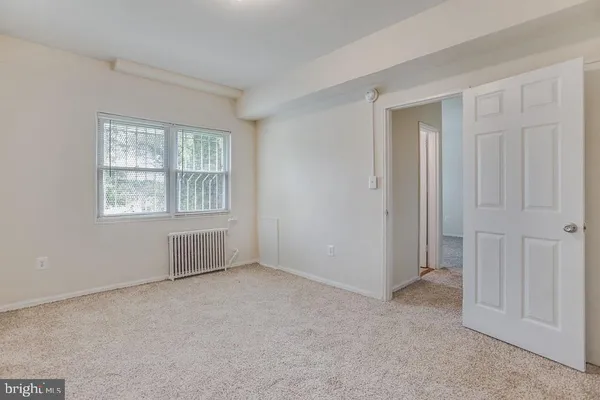 a view of an empty room with a window