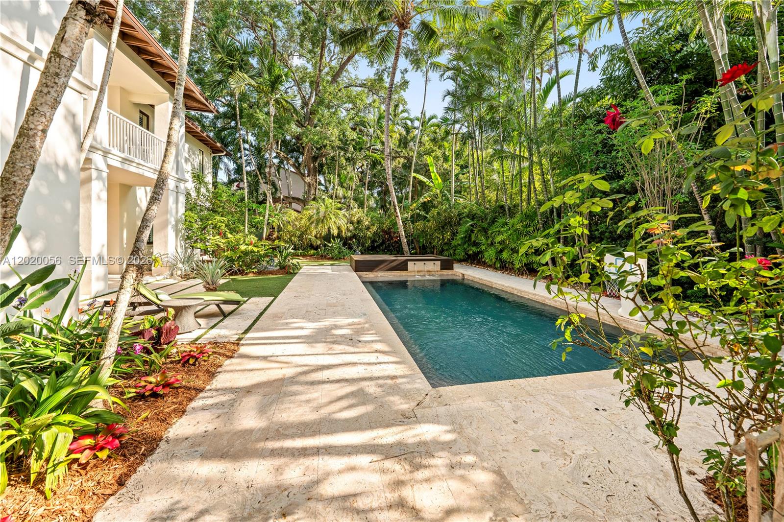 4196 Douglas Road Miami, FL 33133 - Photo 87 of 96 a view of backyard with plants and large trees