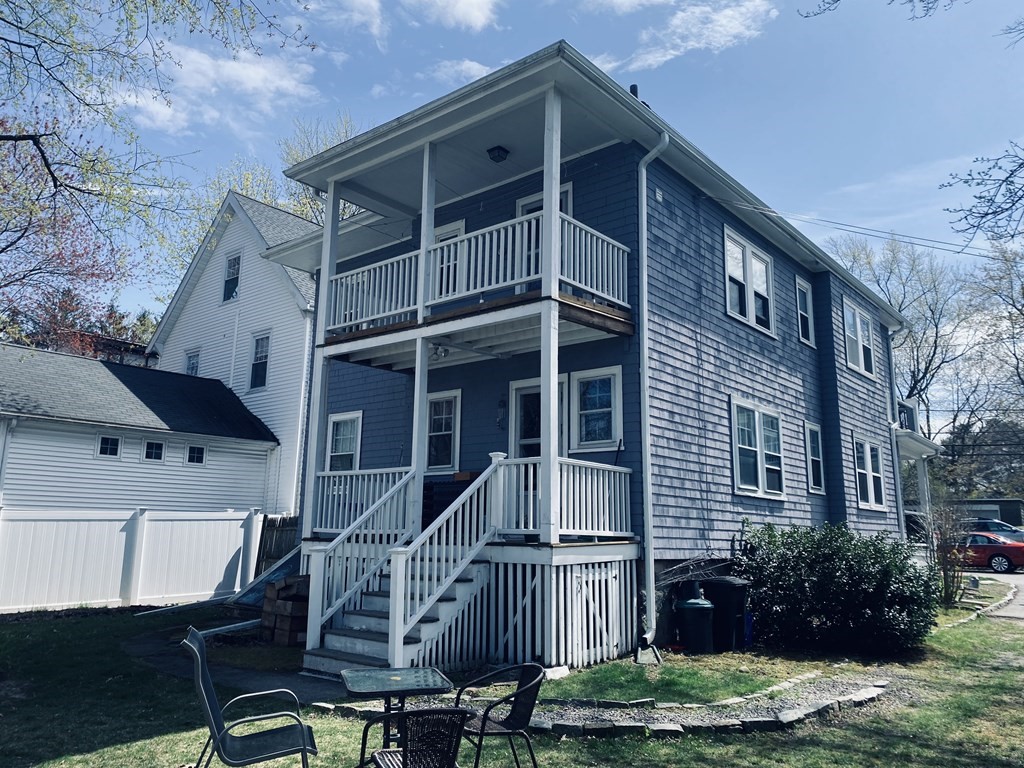 15 Glenland Road Brookline, MA 02467 - Photo 2 of 4 a front view of a house with garden