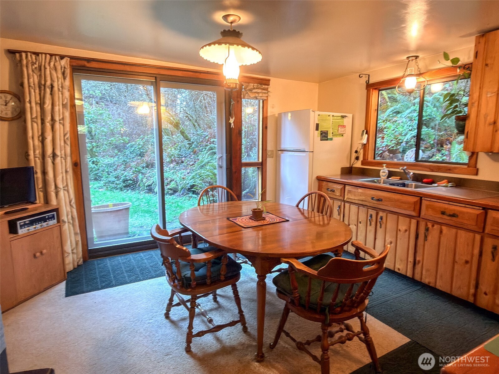 890 Black Bear Road Port Townsend, WA 98368 - Photo 13 of 40 a view of a dining room with furniture window and outside view