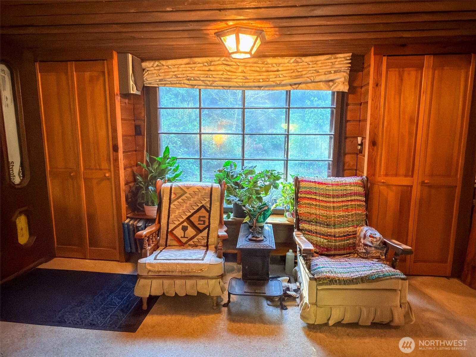890 Black Bear Road Port Townsend, WA 98368 - Photo 15 of 40 a living room with furniture and a window