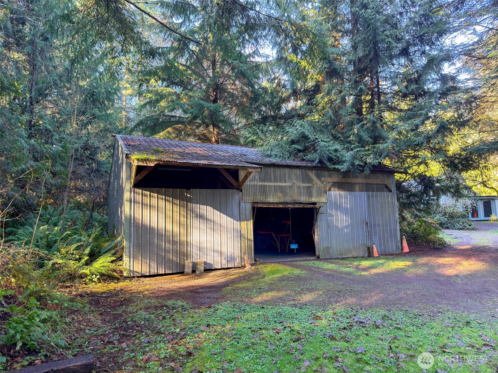 890 Black Bear Road Port Townsend, WA 98368 - Photo 33 of 40 a front view of a house with a yard and garage