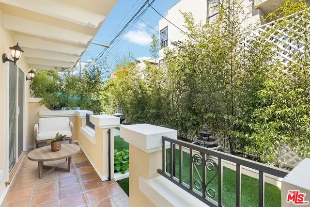a view of a balcony with furniture