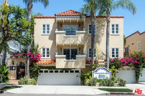 a lot of flowers outside a house