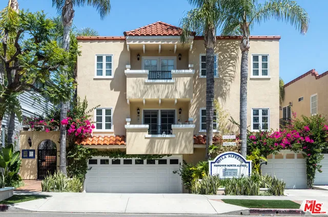 a lot of flowers outside a house